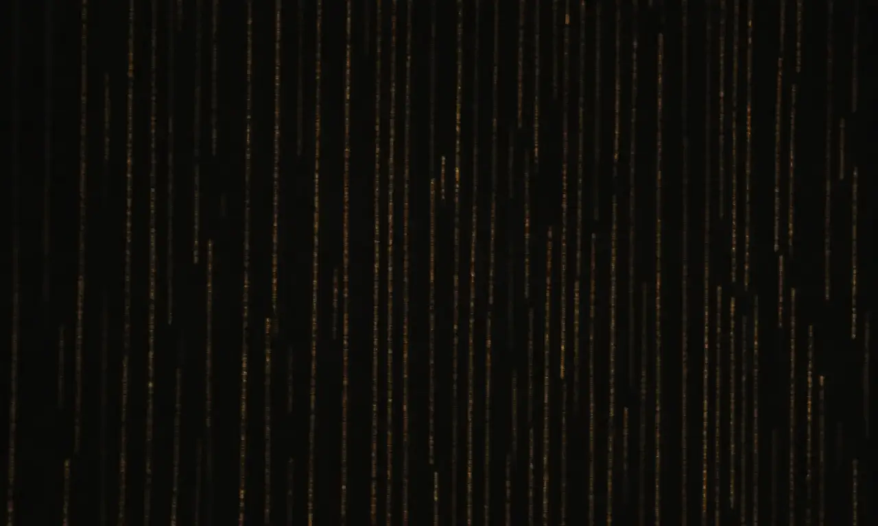 Índices de datos con estilo se mueven y brillan en un backdrop de gris carbón