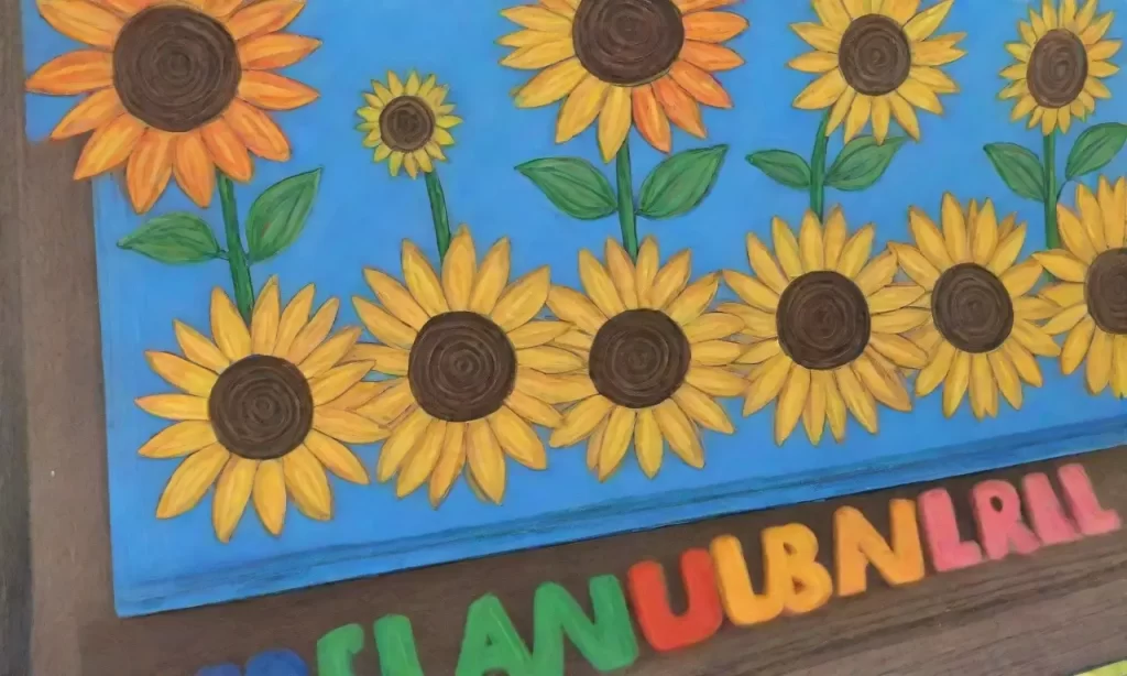 Un paraíso de color y aprendizaje.   (A paradise of colors and learning.)**Explanation:** I chose this sentence as it captures the essence of the description while keeping it concise. Paradise conveys the beauty and positive atmosphere
